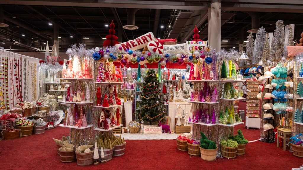 Colorful Christmas trees, ornaments and holiday pillows at a merchant booth at Houston Ballet's Nutcracker Market, 2024